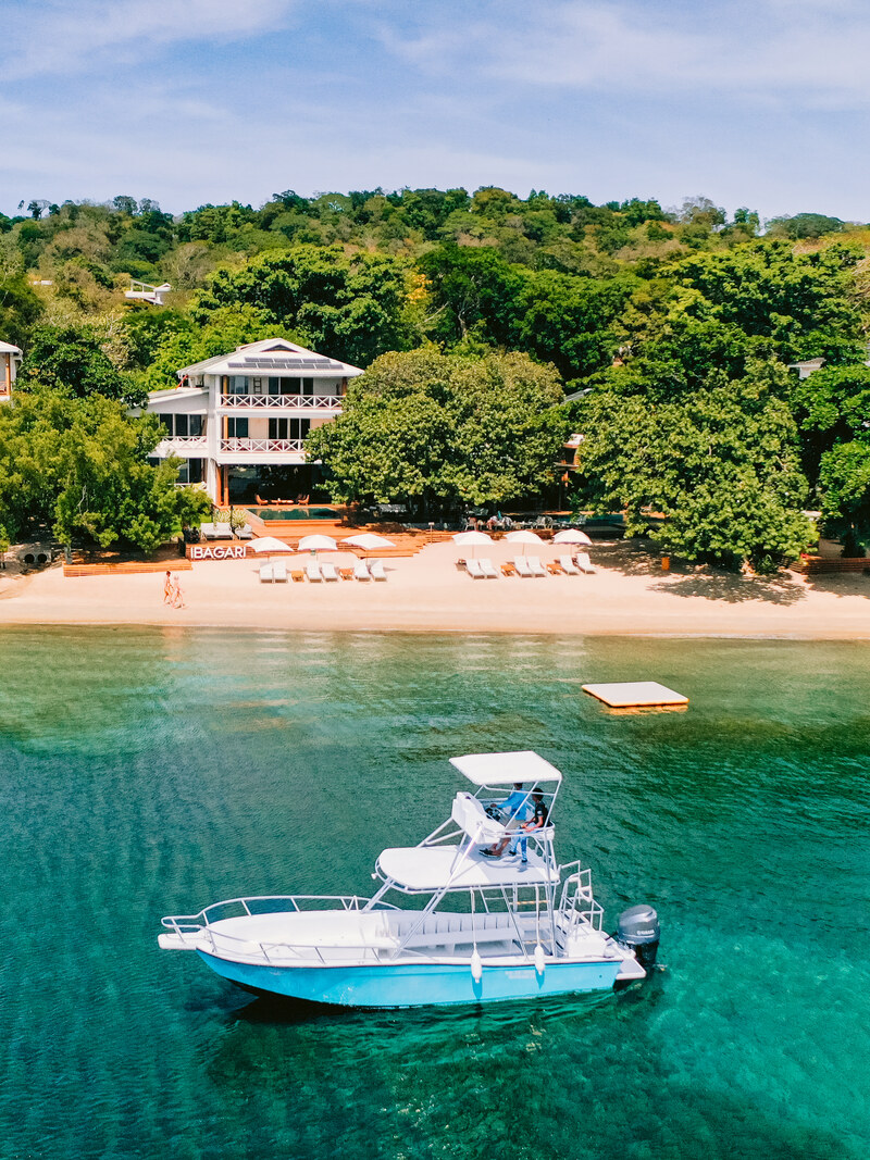 The hotel seen from the bay, a boat on the water