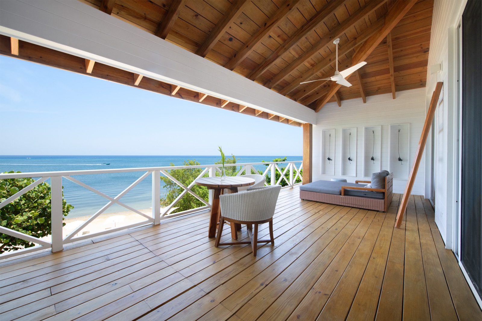 A balcony daybed facing the water